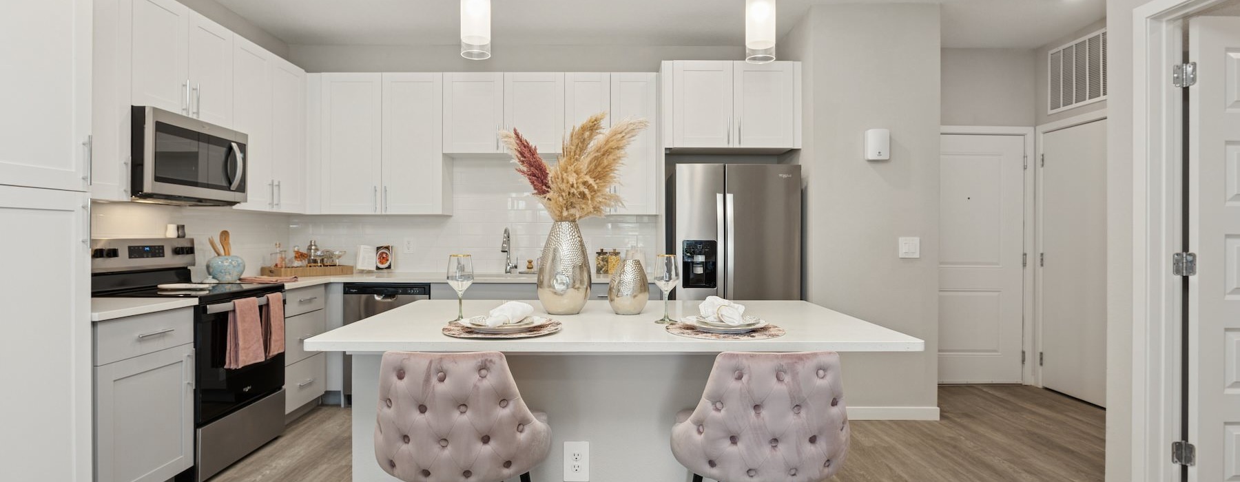 a kitchen with white cabinets