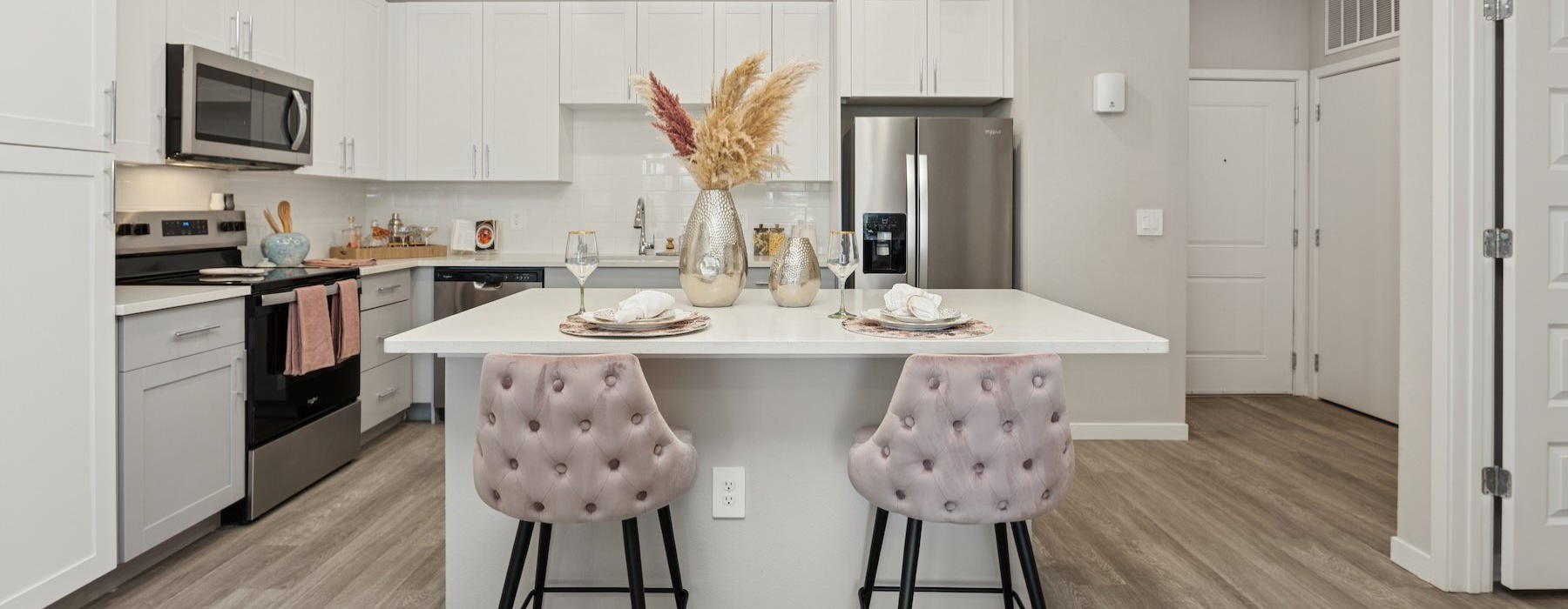 a kitchen with white cabinets