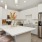 a kitchen with white cabinets