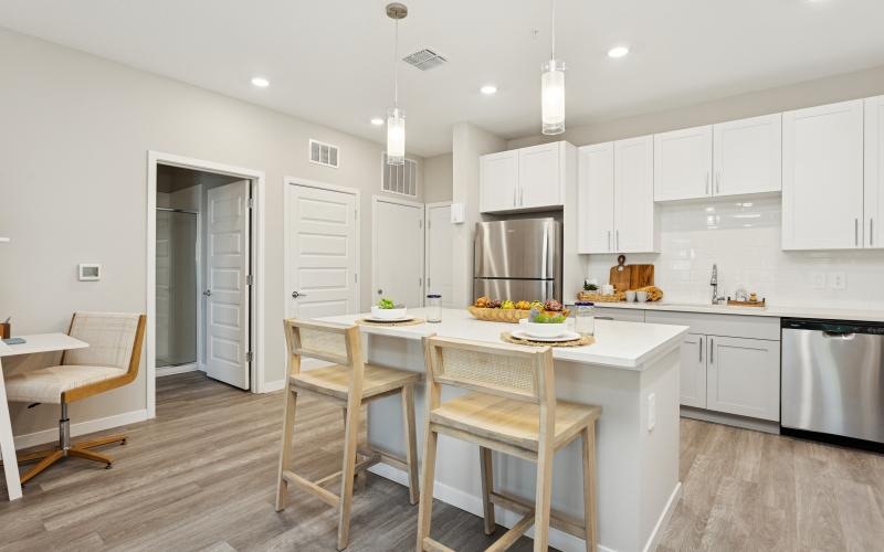 a kitchen with white cabinets