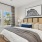 a bedroom with a large window