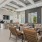 a clubroom with a couch, tables and chairs