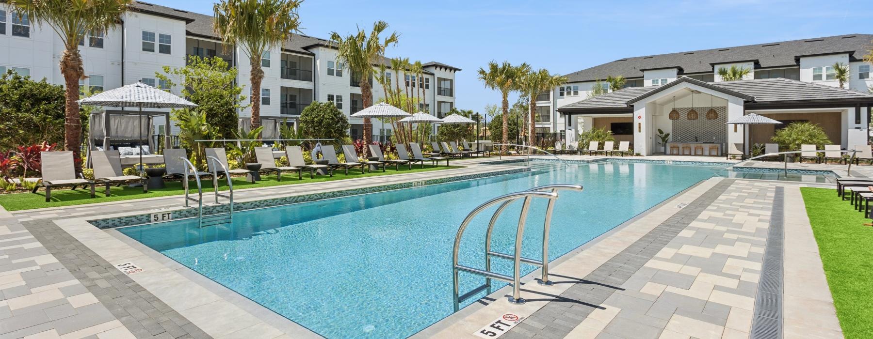 a swimming pool with a building in the background