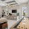 a clubroom with a bar, couches, chairs, tables and a table game